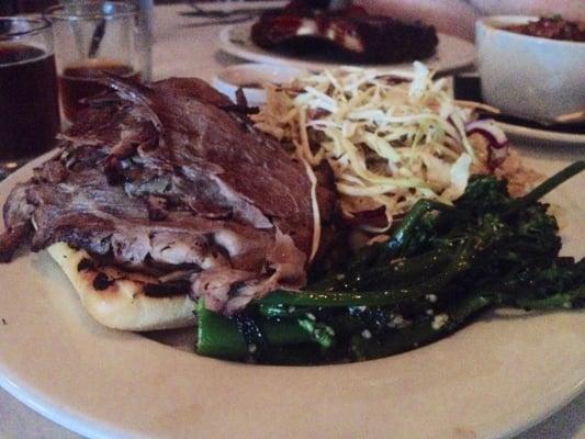 Brisket sandwich with pepper cole slaw and sautéed broccolini