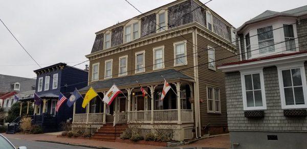 The outside of the Flaghouse Inn with our state flag flying!