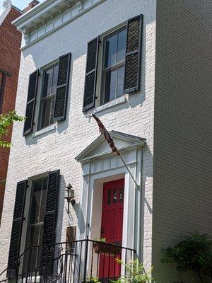 Poor upkeep of property.  The flag is old, torn, and tattered.