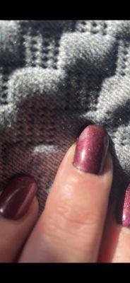 Gel polish pooled over cuticles. Polish totally lifted and flaked off on this nail - within 24 hours of nails being done.