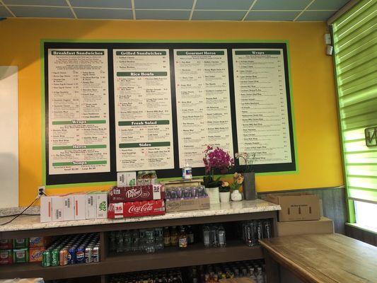 Front right new menus on yellow spot of color wall and blue ceiling tiles