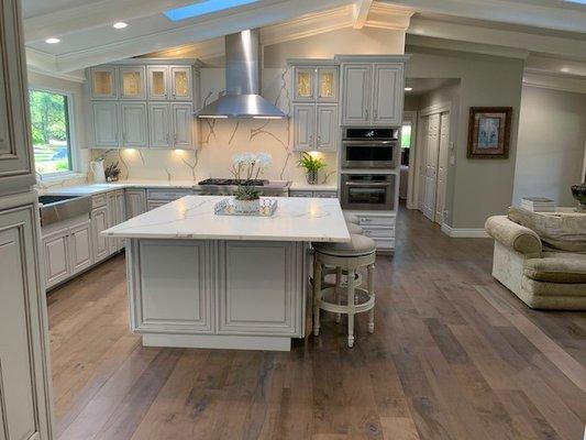 The hardwood flooring from Preverco adds a bit of rustic charm that makes this spacious kitchen feel even more inviting and welcoming.