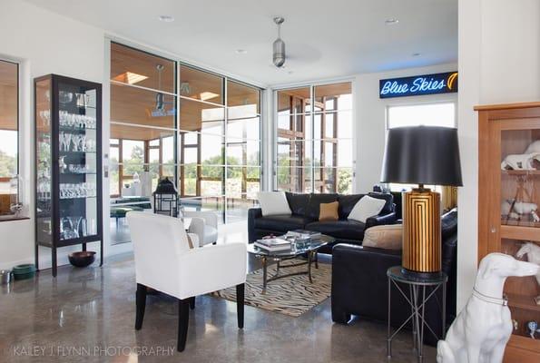 Living Room (kitchen behind viewer). Sliding doors lead to screened in pool.