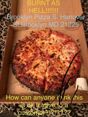 Burnt pizza I received from Brooklyn Pizza