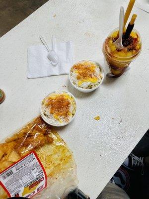 Churros con chile, two esquites, and mango slushy