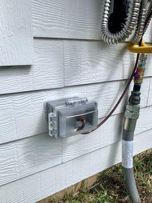 Outdoor outlet for tankless water heater.