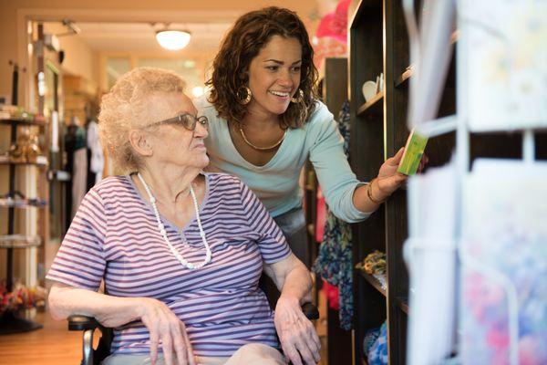 Resident of Care Center and staff browsing the goodies in our Gift Shop