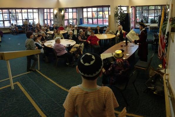 Rabbi's son Boruch visiting a home for the elderly on Purim