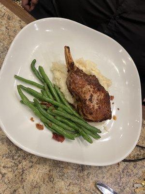 Pork chops, green beans and mashed potatoes.