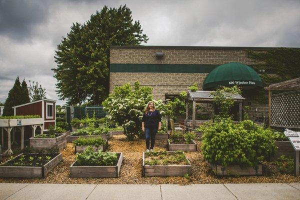 Founder Jessie Banhazl in the garden at GCG headquarters in Somerville