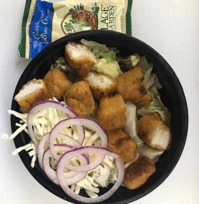 Buffalo Chicken Salad with chucks of fresh fried boneless wings and Texas Pete hot sauce.