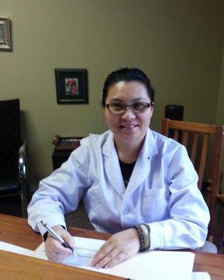 Yang Gong (Dr. Grace) in her Kansas City acupuncture clinic.