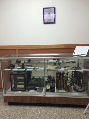 Glass case with electrical items.