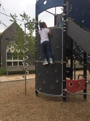 Rock climbing with a church in the background. Perfect!