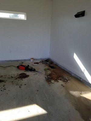 Termite man drilled through water line in garage.