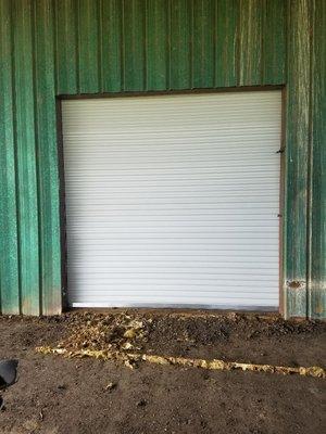 This is the shop wall after the Roll Up Door has been installed