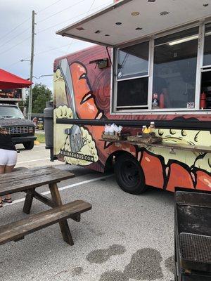 Picnic area seating next to Kielbasa Bus