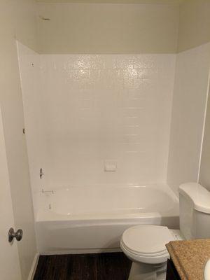 Tub with tile enclosure resurfacing.