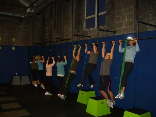 Strong women doing pullups