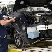 Technician taking a vehicle apart