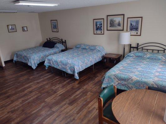 Three queen beds, refrigerator, coffee pot, cable TV, WiFi,