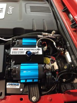 Shop jeep getting ARB compressor installed.  Stop by for and we will help you accessorize your Jeep,  truck and SUV.