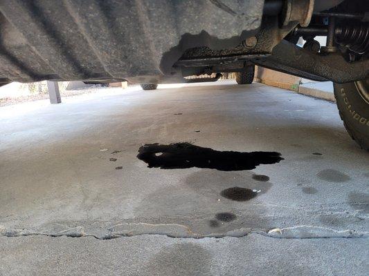 Why is the oil I'm leaking all over my driveway black ?