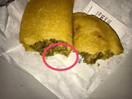 Opened up what was supposed to be a chorizo empanada but was given a ground beef with a hair in it.