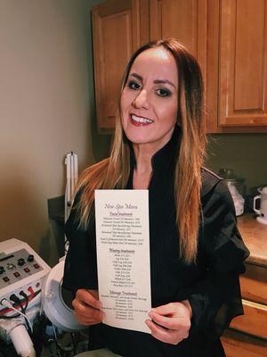 Our Esthetician, Naime holding our NEW spa menu! Come in and check it out!