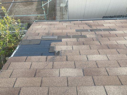 Blown roof shingles after the storm