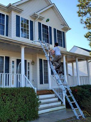 Siding soft wash and gutter brightening.