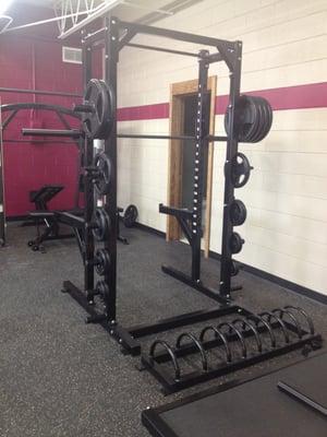 Smith rack with squat rack in the background.