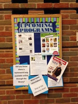 Bulletin Board displaying upcoming programs at the library.