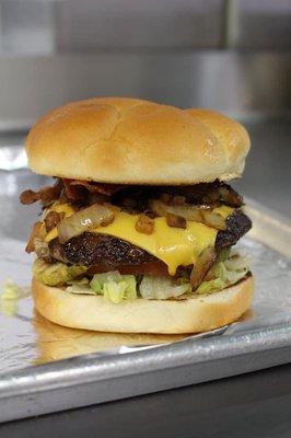 Bacon cheese burger with grilled onions and the works