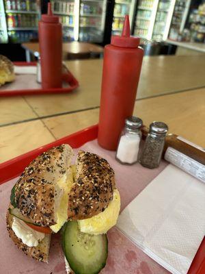 Everything bagel with cream cheese, egg, cucumber, tomato