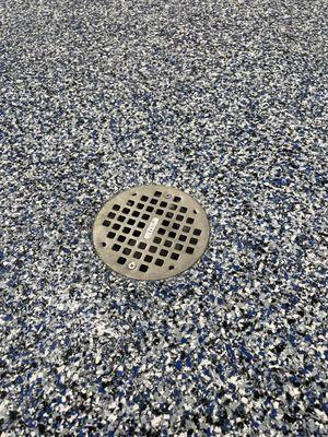 Flake Epoxy Garage Floor showing the drain by Grindkings Flooring