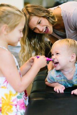 Dr. Brittany adjusting a little boy.