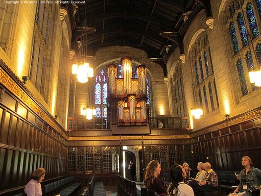 Guests arrive for a recital of the new Reneker organ. Looking south at the loft and entrance to the chapel.