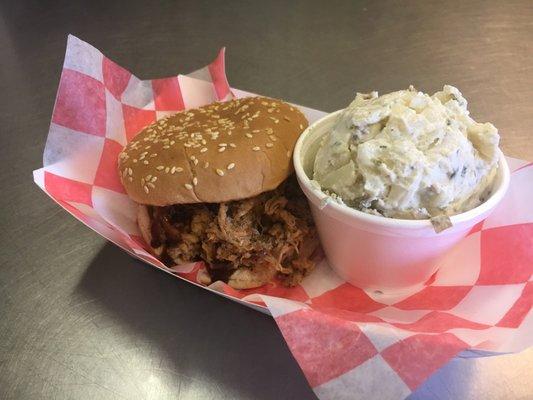 Pulled pork sandwich with loaded baked potato salad