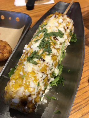 Sweet corn on the cob with some of the Mexican street corn toppings-- no chili seasoning