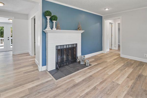 Finished front room with new flooring and arch install.