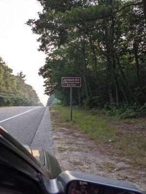 You'll see this on the right on the road if you're heading west. The trail is on the left!