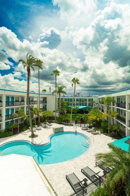 Sunny view of our pool from the balcony.