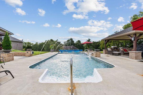 A view of the pool with the fountains on at Iroquois trail