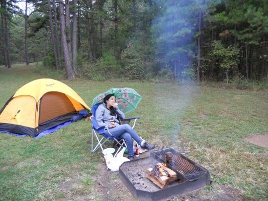 Our humble little campsite. And a bratwurst. And a can of beans nicely cooking on the grill.