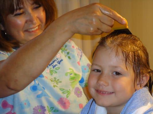 LiceDoctors technician removes lice and nits from client.