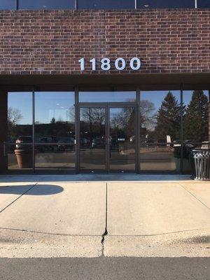 Entrance to the building. Stairs to the right, elevator to the left.