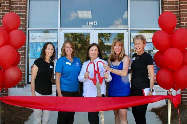 Grand Opening with cruise consultants and town council member.