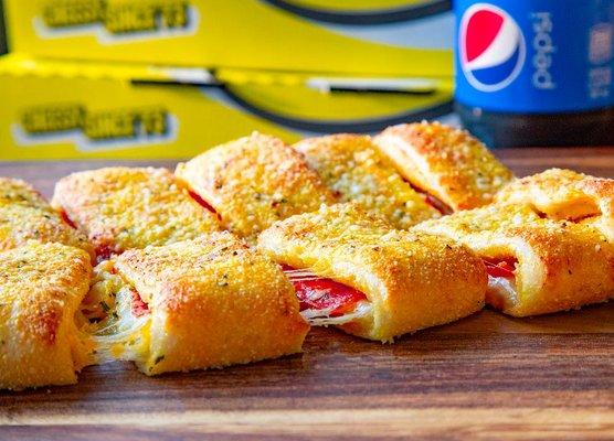 Pepperoni Stuffed Howie Bread stuffed with pepperoni, mozzarella & cheddar cheese. Topped with butter, garlic herb & parmesan.