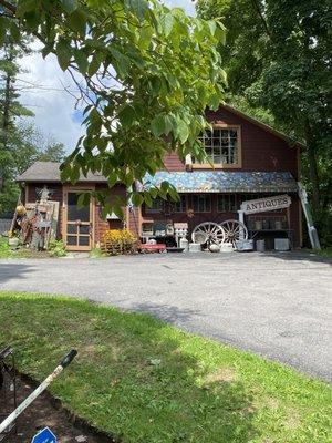 Don't miss the goodies in the barn. Lots of antiques inside and out. Upstairs is the sale loft.